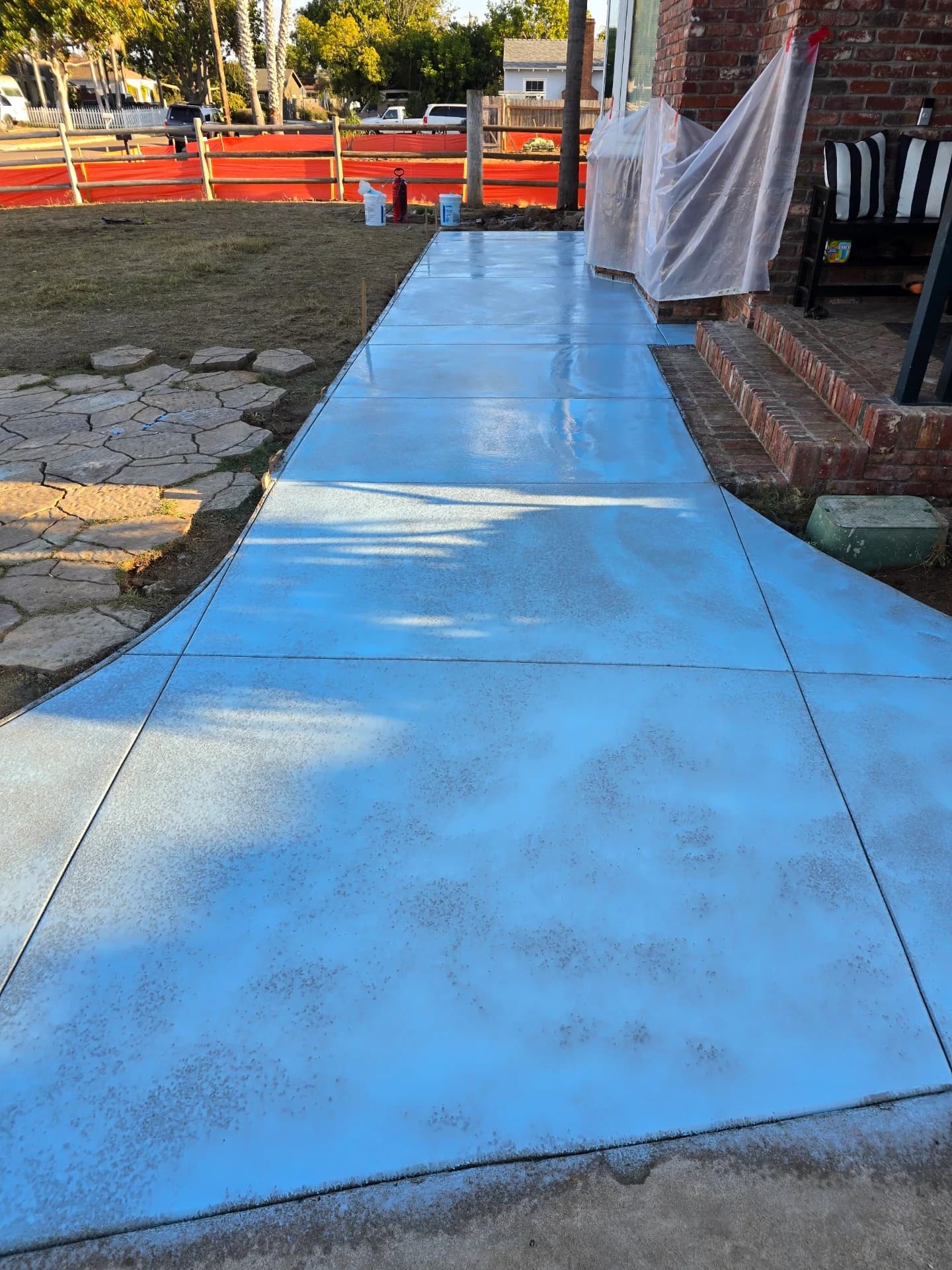 Decorative colored concrete walkway with a smooth finish