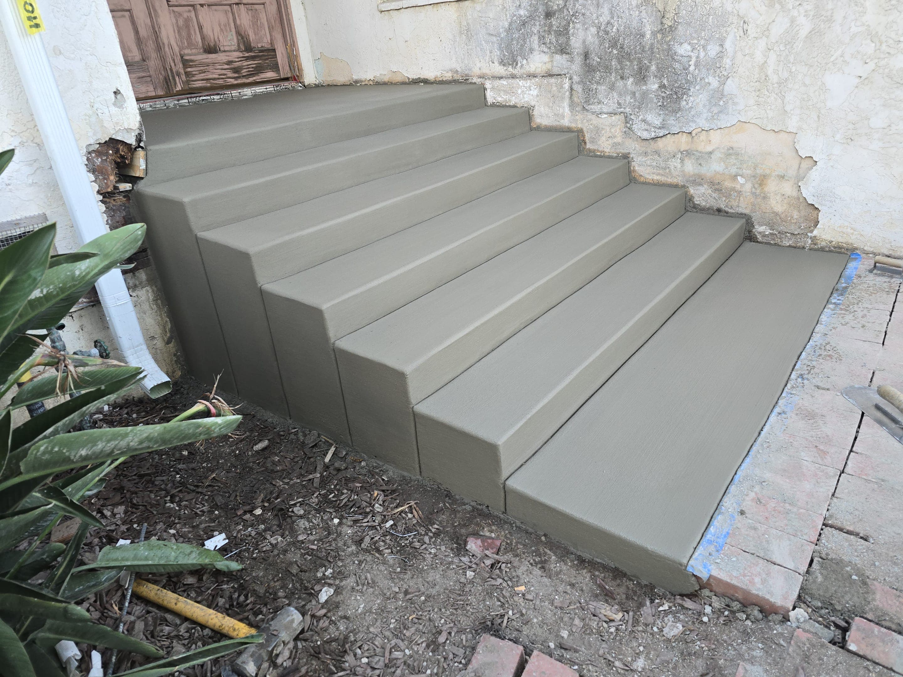 Finished concrete front entry steps