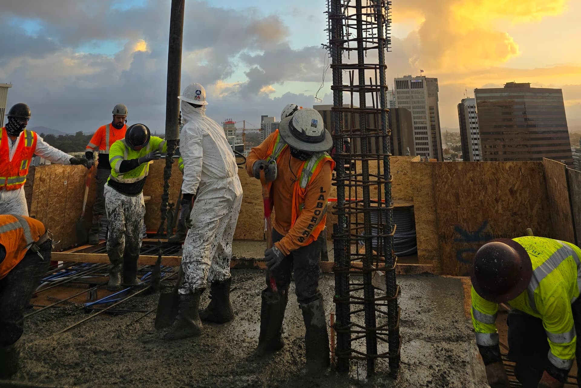 Smokes Concrete crew placing a commercial concrete pour at sunset in San Diego